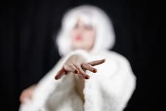 Attractive young woman in costume looking at camera while standing on black background Dame und Vamp, Leben neben den Konventionen (Foto: Burges-Pieper)