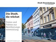 Foto von der belebten Hauptstraße und darüber ein Textfeld "Die Stadt, die wächst"