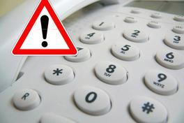 Telefon und Warnzeichen mit Ausrufezeichen
