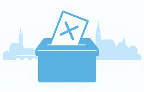 Im Vordergrund ist eine Wahlurne zu sehne. Im Hintergrund ist eine Ansicht von der Skyline in Brandenburg angedeutet.