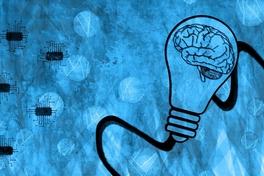 Zeichnung einer blauen Glühbirne mit einem Gehirn darin