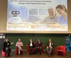 Die Experten beim Podiumsgespräch im Austausch mit dem Publikum.